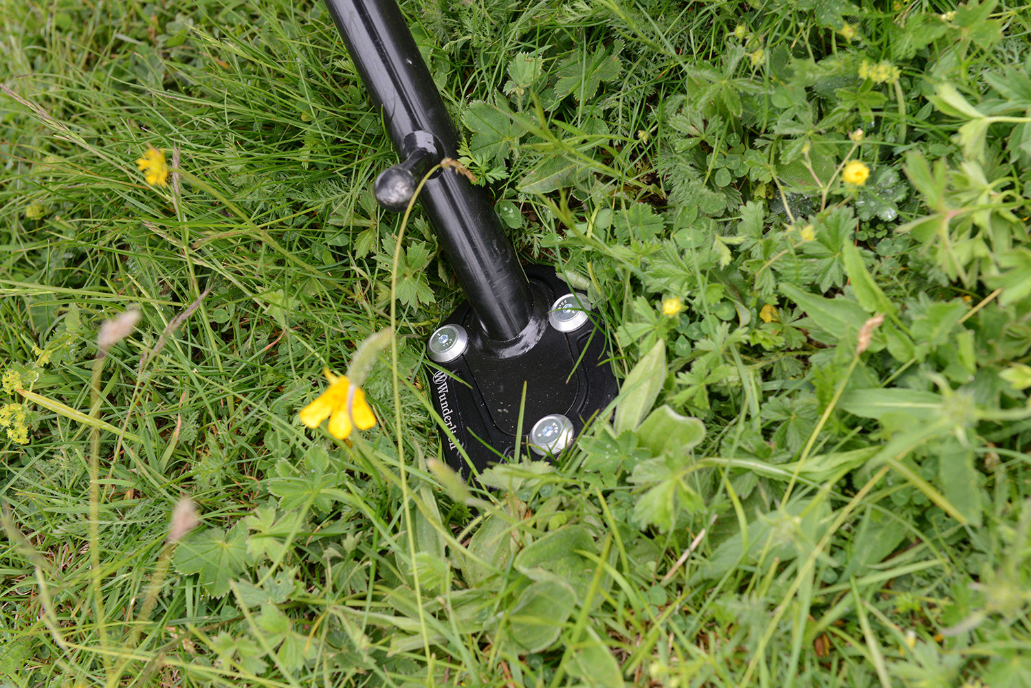 A precisely machined extension plate that can quickly be bolted to the side stand eliminates this risk.