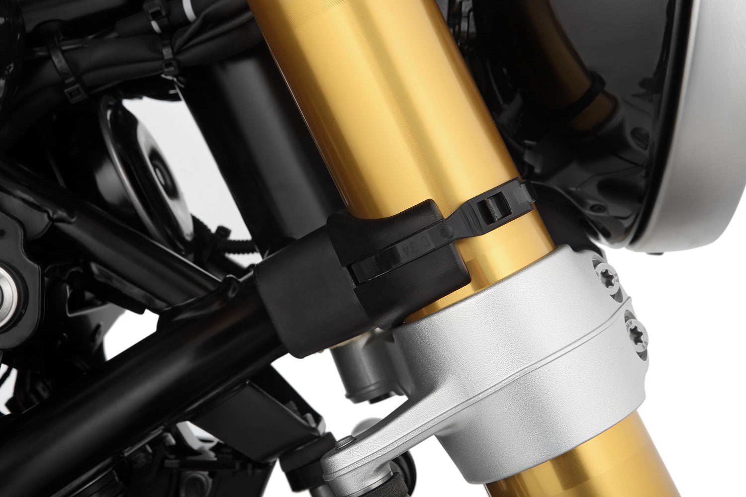 Limit and dampen the steering angle in the event of a fall, even before the standard steering stops are reached with full force