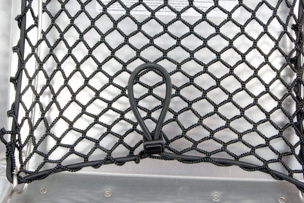 You can store additional luggage in the cover of the original aluminium topcase and have it ready to hand right after opening