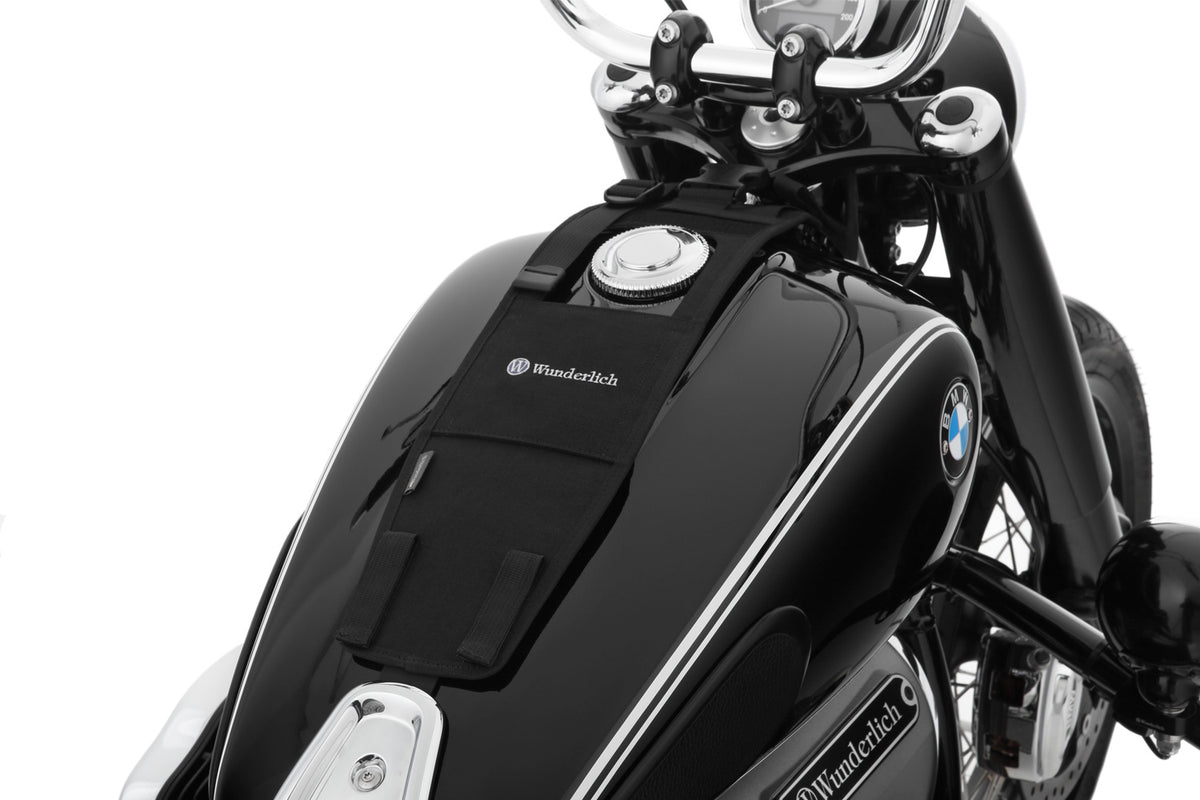 The mounting system is attached to the vehicle with minimal hand pressure and the tank bag can be quickly fastened to it.