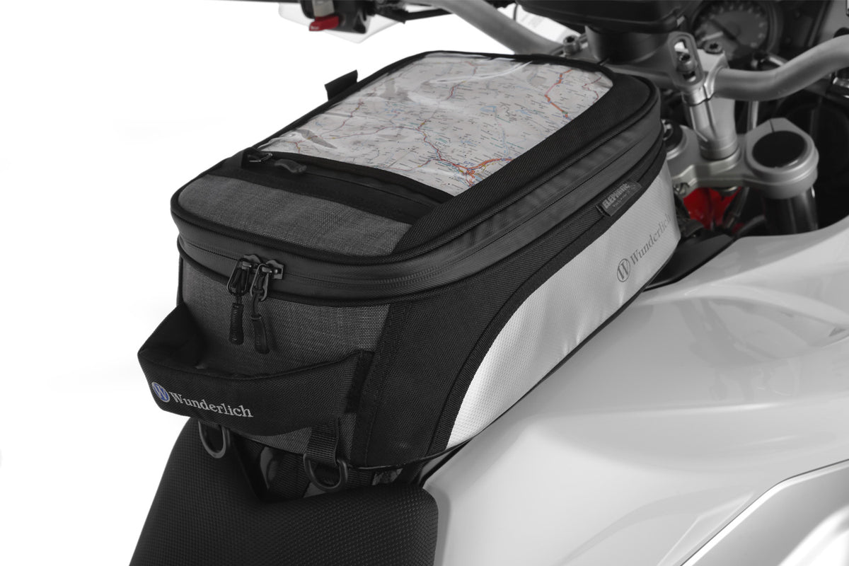 The mounting system is attached to the vehicle with minimal hand pressure and the tank bag can be quickly fastened to it.
