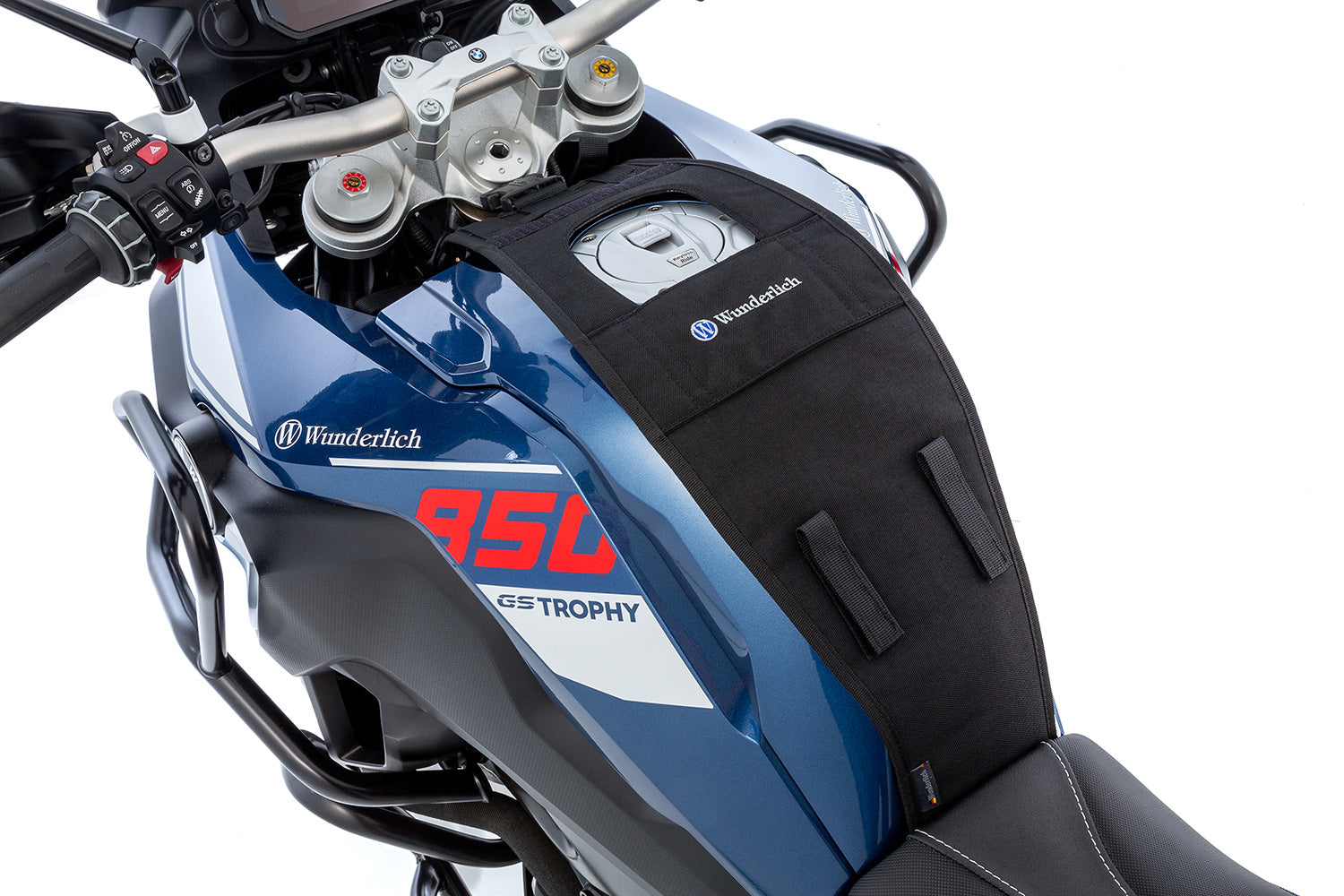 The mounting system is attached to the vehicle with minimal hand pressure and the tank bag can be quickly fastened to it. 