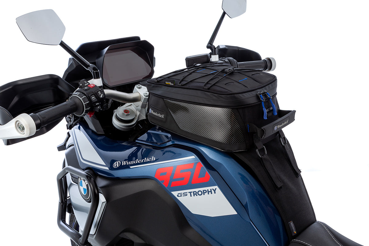 The mounting system is attached to the vehicle with minimal hand pressure and the tank bag can be quickly fastened to it.