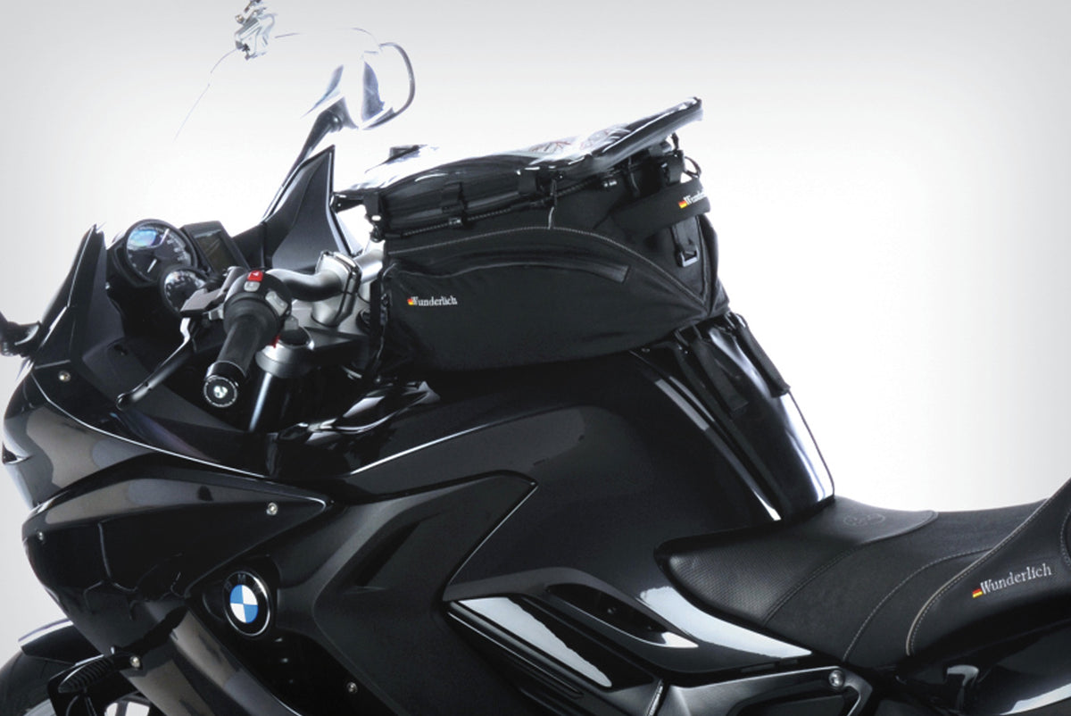The mounting system is attached to the vehicle with minimal hand pressure and the tank bag can be quickly fastened to it.