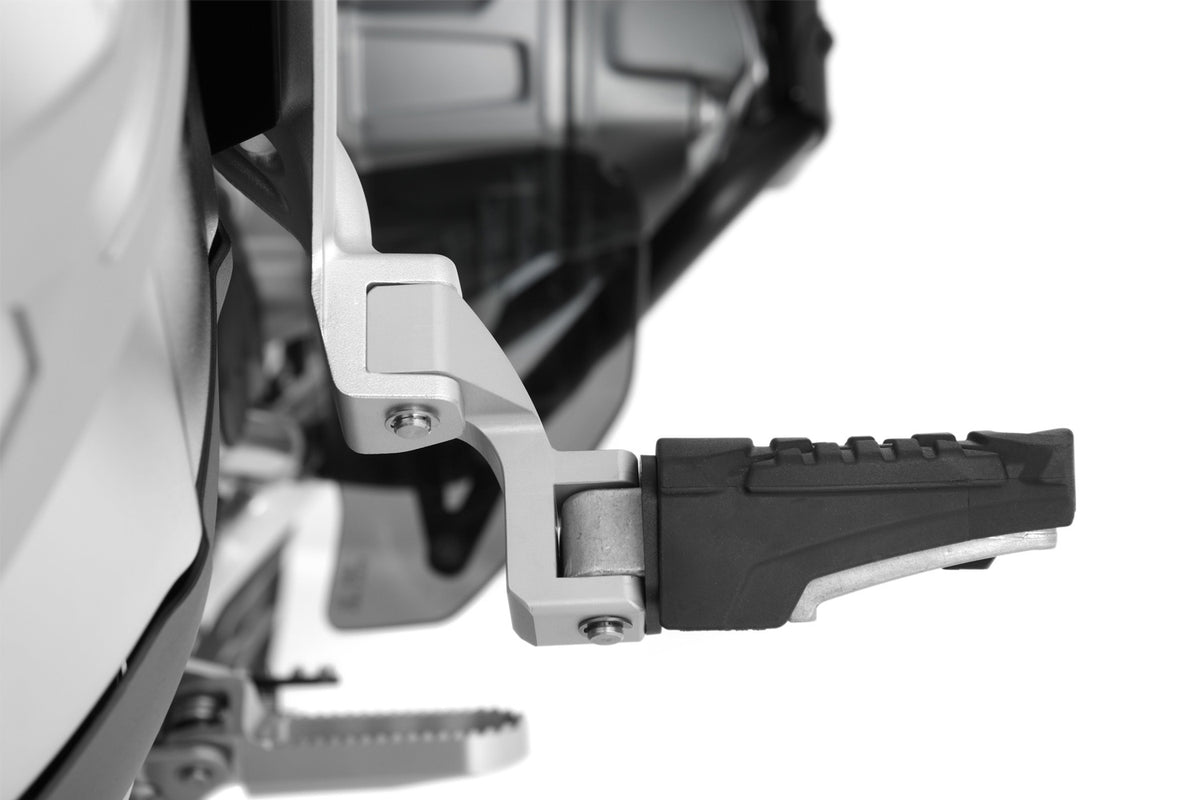 The Wunderlich lowering set will move the footrest down and slightly forward.