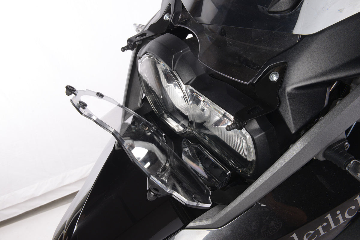 Foldable head light grille from Wunderlich provides effective protection for your bmw R1200GS LC Adv. headlight protection.