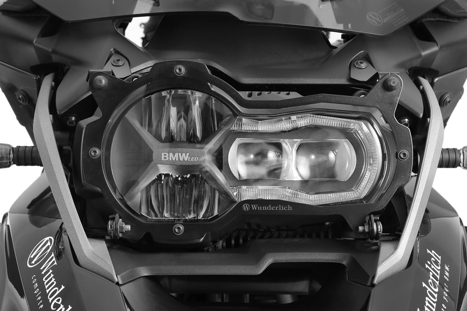 Foldable head light grille from Wunderlich provides effective protection for your bmw R 1200/1250 GS LC Adv. headlight protection.