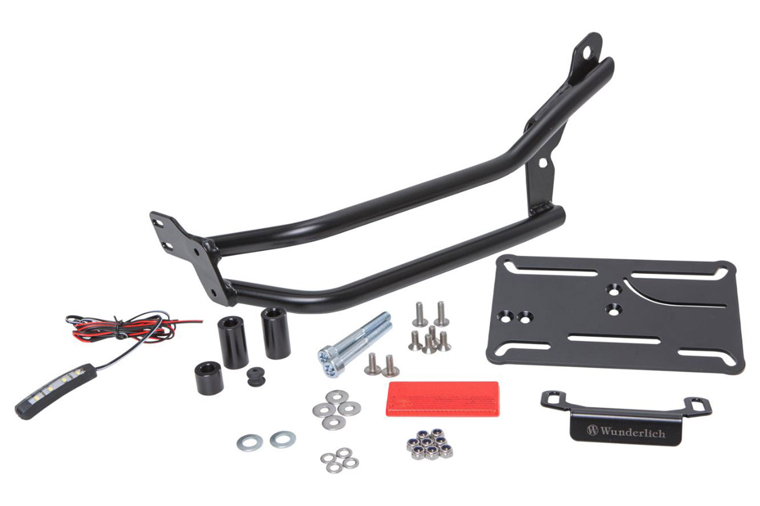 Discretely and lightweight number plate holder which integrates excellent into the sporty line of the Roadster