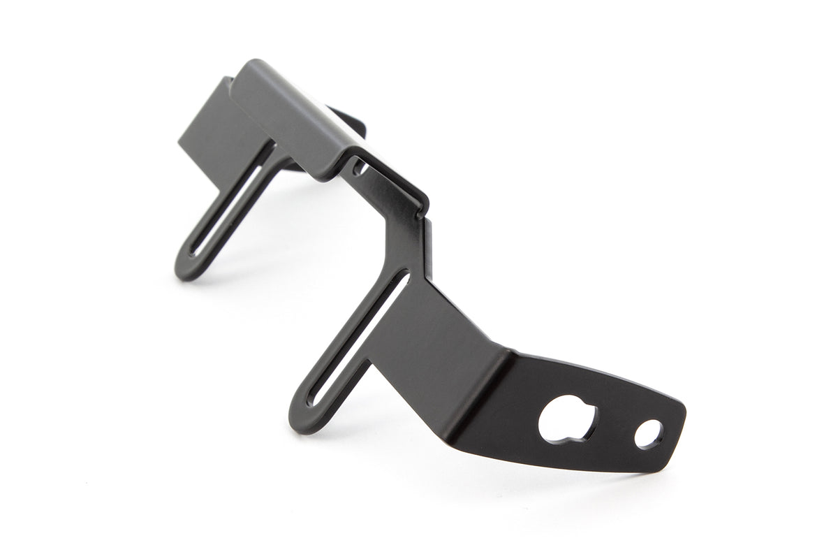Custom-fit indicator holder for use with wide number plates (>180 mm)