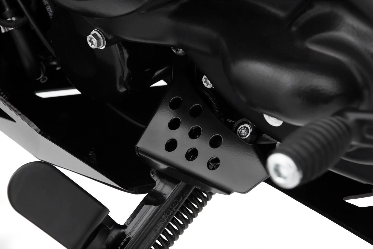 Solid all-round protection for the exposed ignition interruption switch on the side stand.